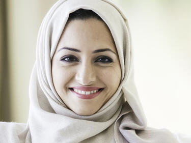 Smiling middle eastern woman in hijab